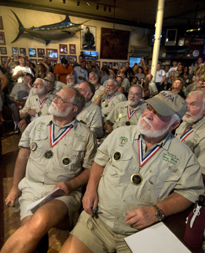 Image 2 - Previous winners of the "Papa" Hemingway Look-Alike Contest, including Fred Johnson, front left, and Denny Woods, front right, intently watch the 2010 finalists. 